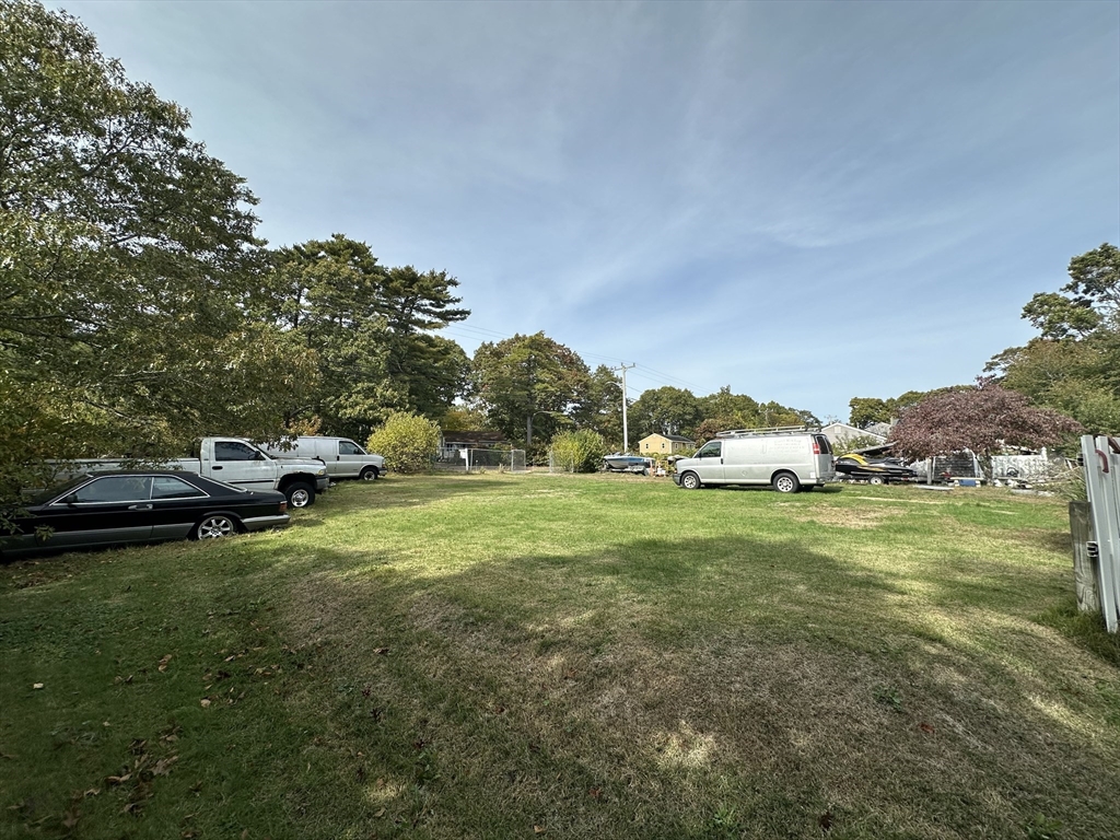47 Mayflower Way Wareham, MA 02538 - Photo 3 of 4 a view of a park with lots of trees and houses
