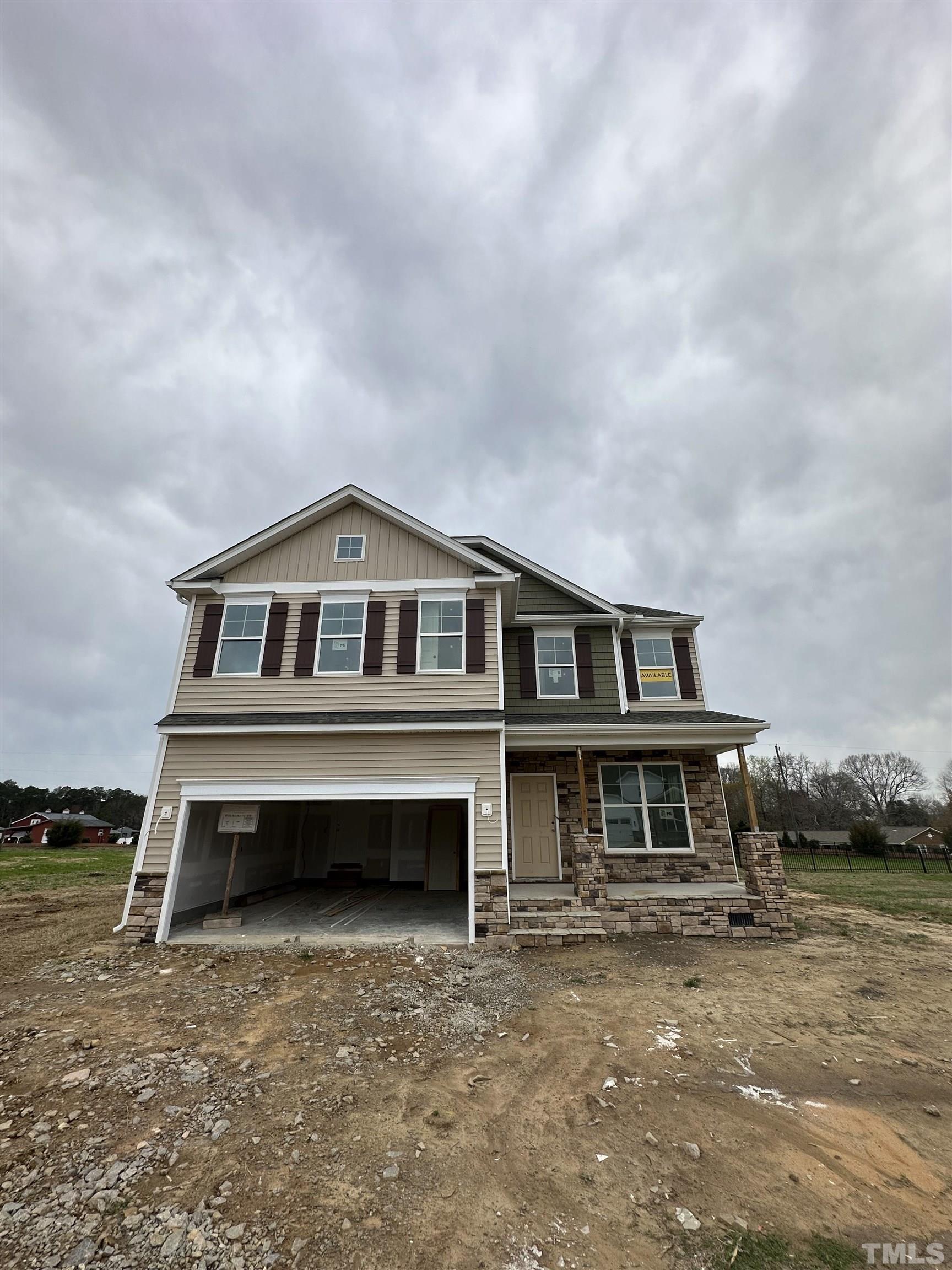 4312 Beckel Road Willow Spring, NC 27592 - Photo 1 of 23 a front view of a house with a yard