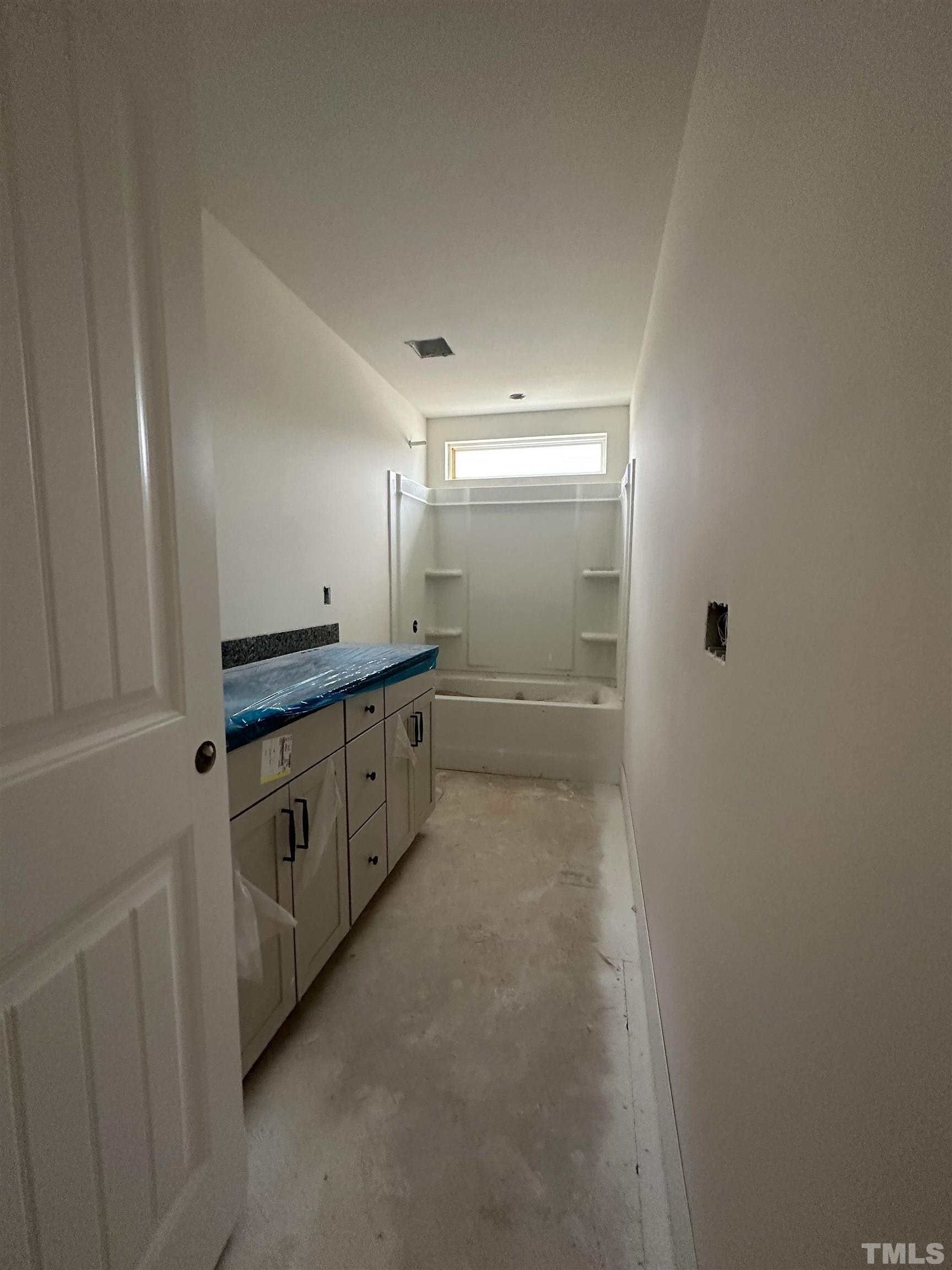 4312 Beckel Road Willow Spring, NC 27592 - Photo 17 of 23 a spacious bathroom with a double vanity sink and a mirror