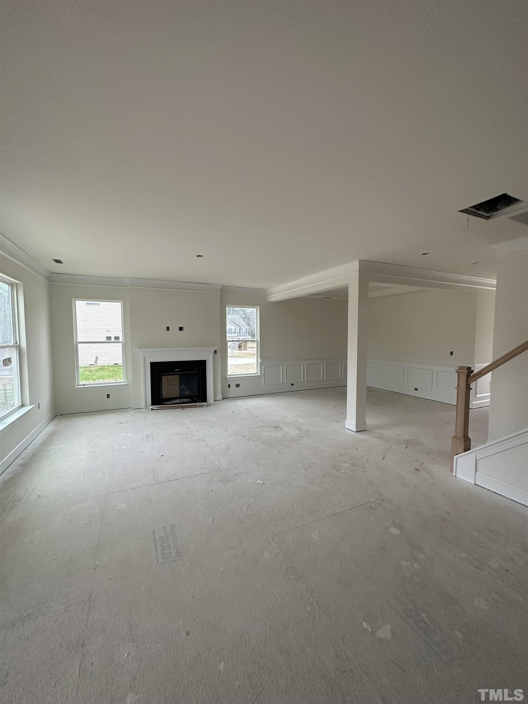 4312 Beckel Road Willow Spring, NC 27592 - Photo 5 of 23 a view of empty room with a fireplace