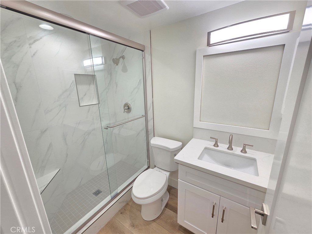 34516 Via Verde Dana Point, CA 92624 - Photo 22 of 22 a bathroom with a shower sink vanity mirror and toilet
