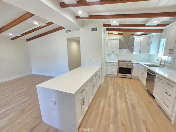 a spacious bathroom with a double vanity sink and a mirror