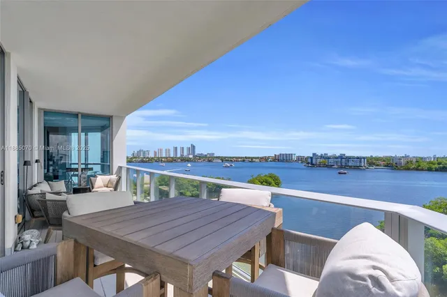 a bedroom with a large bed and a large window