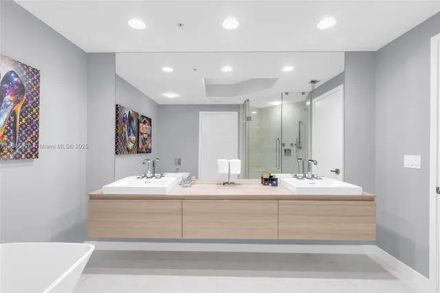 a bathroom with a bathtub and a shower