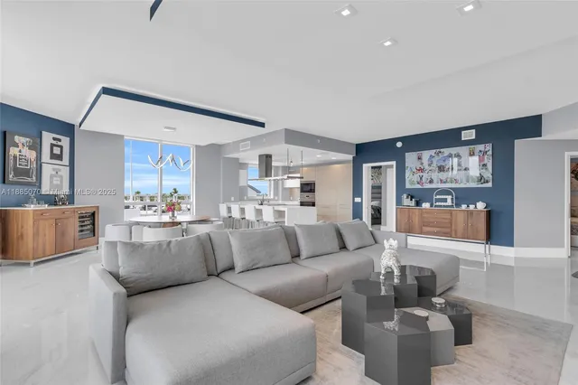 a living room with furniture and a large window