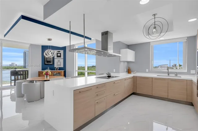 a large kitchen with a large counter top appliances and cabinets