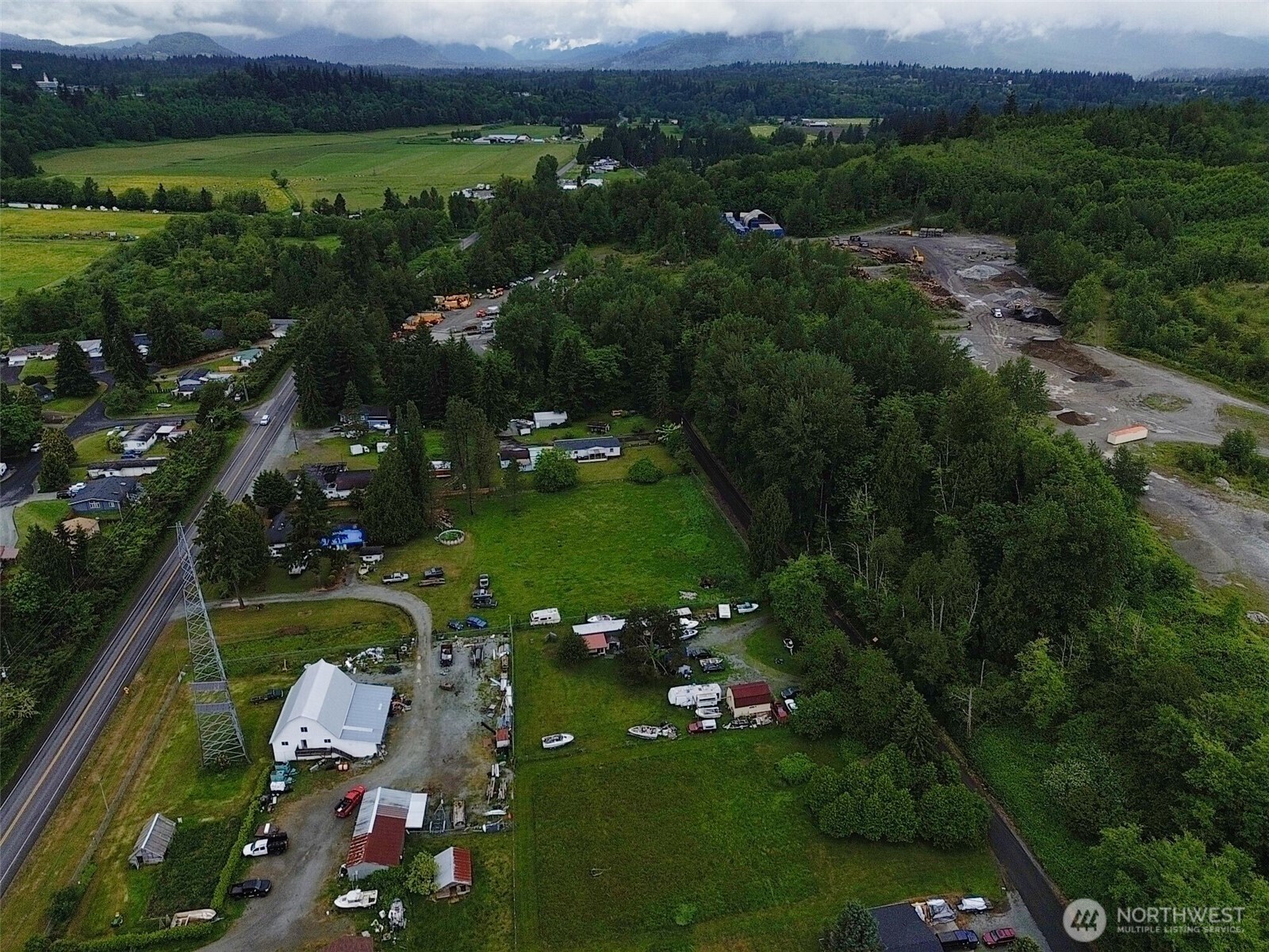 7185 Old Highway 99 North Road Burlington, WA 98233 - Photo 24 of 26 an aerial view of lake residential houses with outdoor space and swimming pool