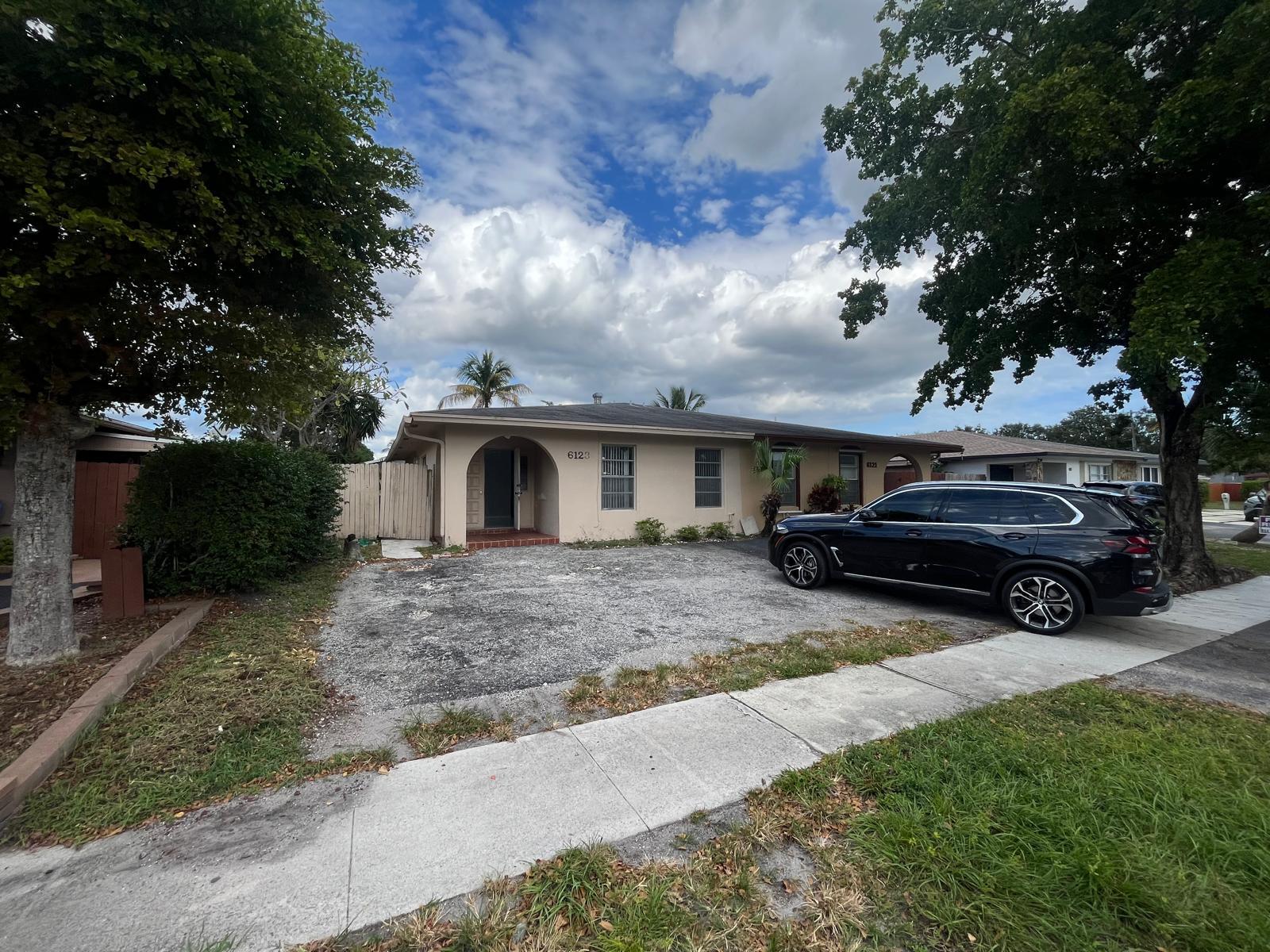 6123 Southwest 4th Place Margate, FL 33068 - Photo 1 of 12 a view of a car in front of house