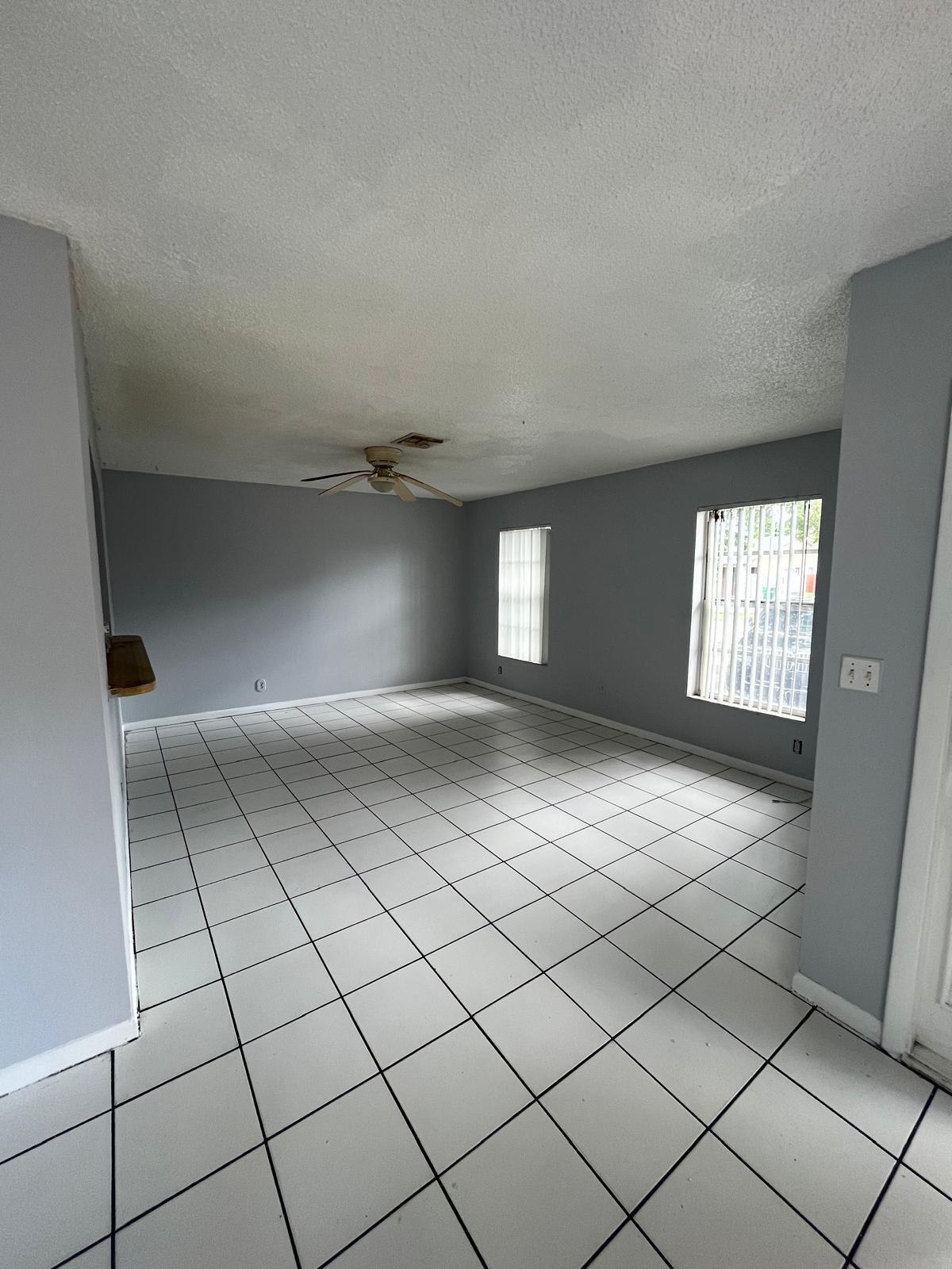6123 Southwest 4th Place Margate, FL 33068 - Photo 2 of 12 a view of an empty room and window