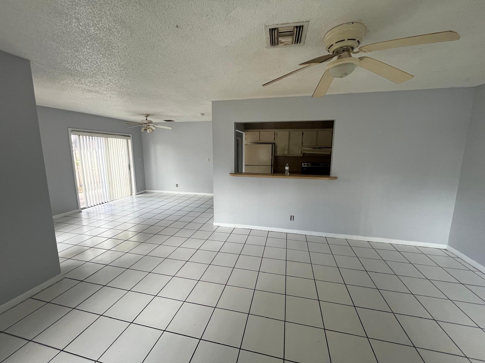 6123 Southwest 4th Place Margate, FL 33068 - Photo 3 of 12 a view of an empty room and window