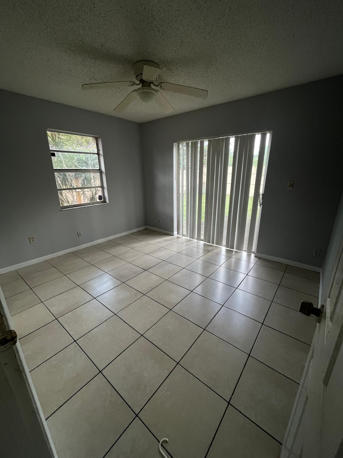 6123 Southwest 4th Place Margate, FL 33068 - Photo 4 of 12 a view of an empty room and window