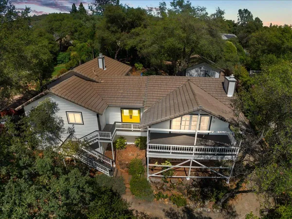 a aerial view of a house with a yard