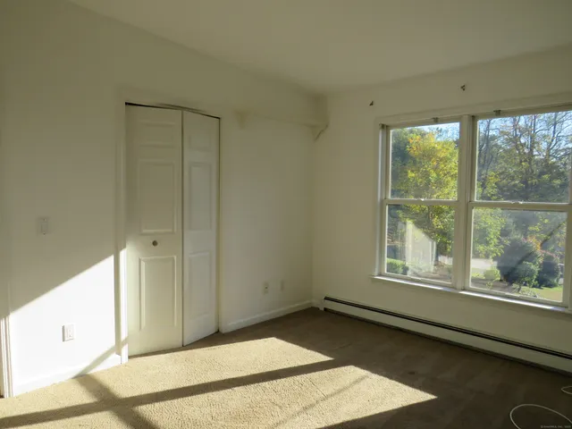 a view of a room that has a window in it