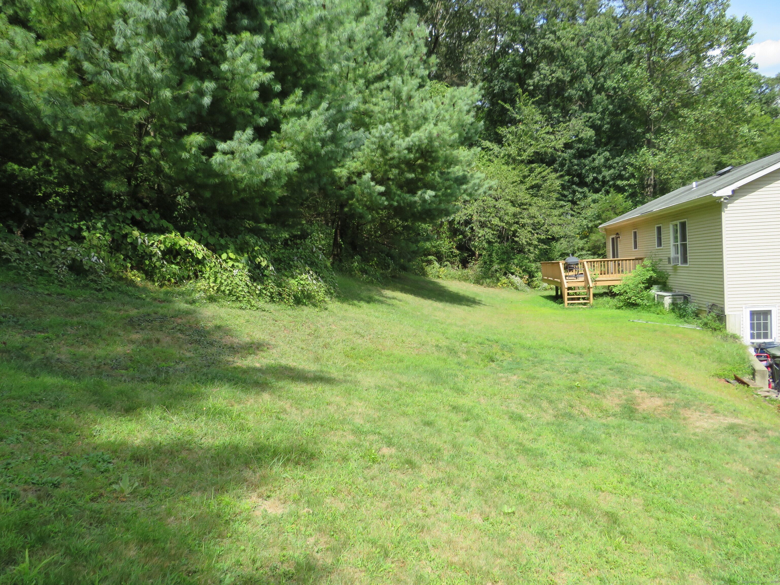 15 Hayestown Heights Danbury, CT 06811 - Photo 17 of 28 a view of a backyard with a garden