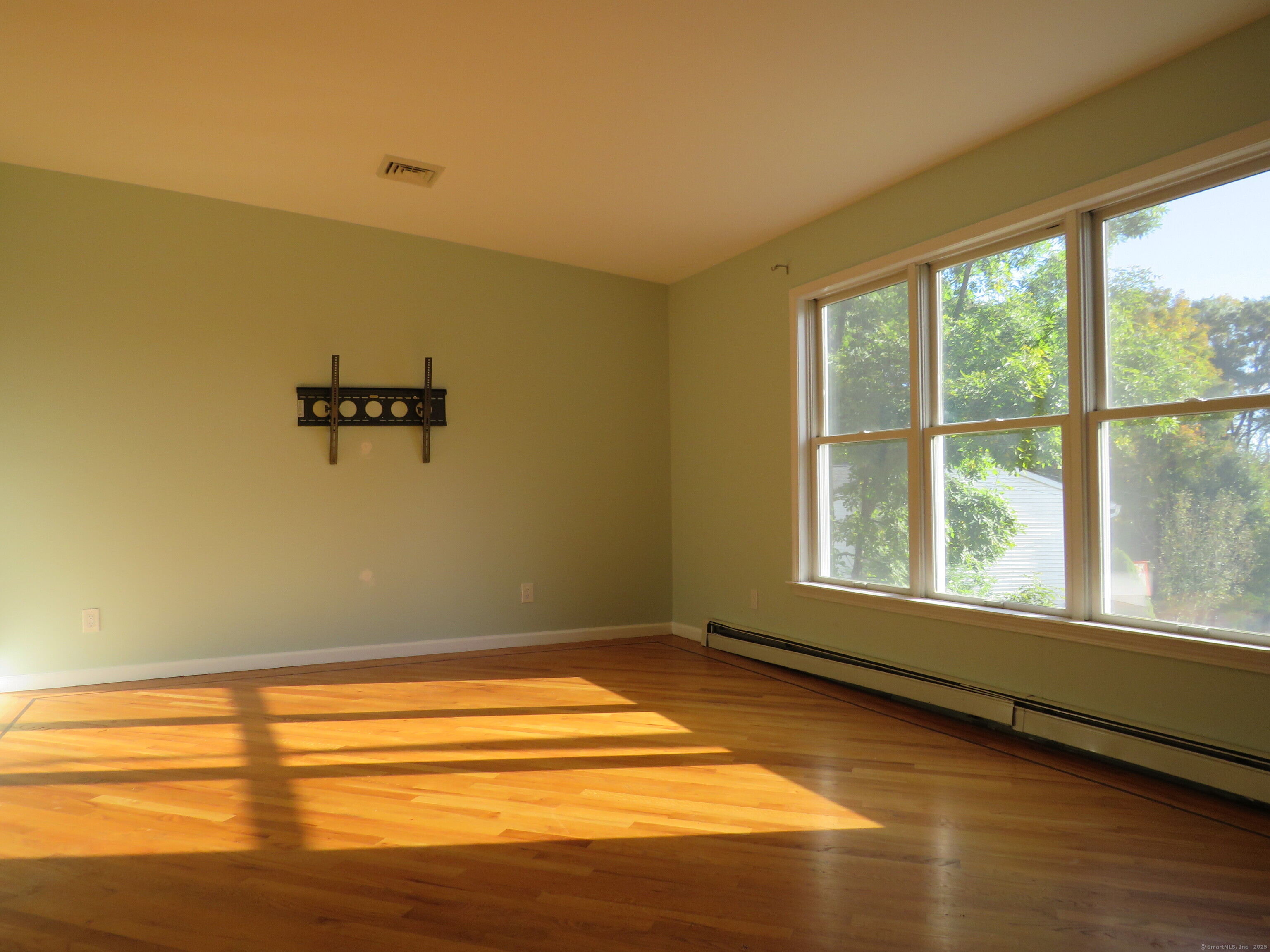 15 Hayestown Heights Danbury, CT 06811 - Photo 4 of 28 a view of a room with rack on the wall and a window