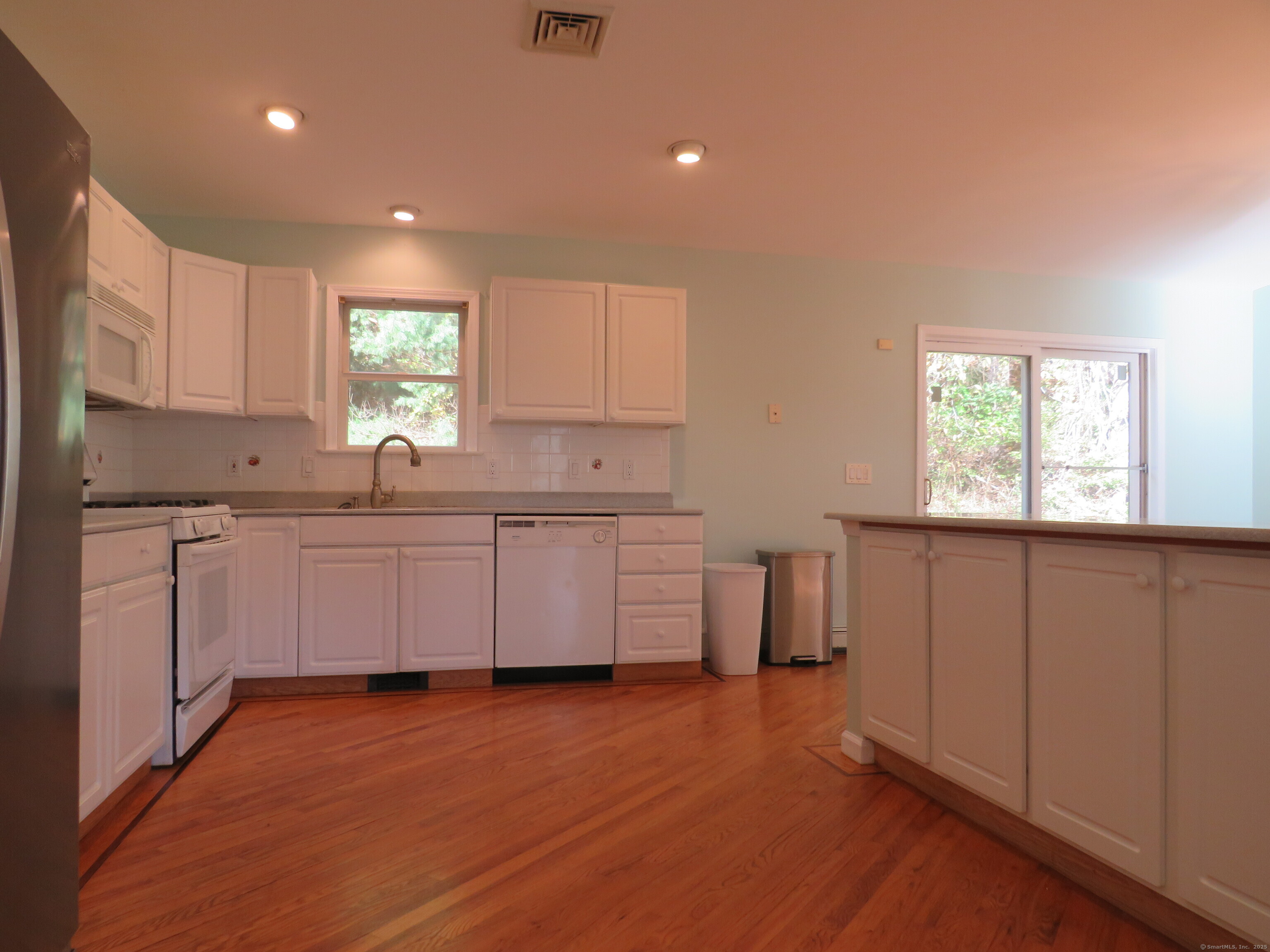 15 Hayestown Heights Danbury, CT 06811 - Photo 9 of 28 a kitchen with a sink cabinets and window