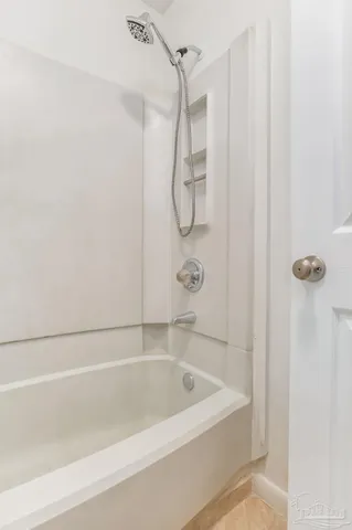 a view of a balcony with wooden floor and iron stairs