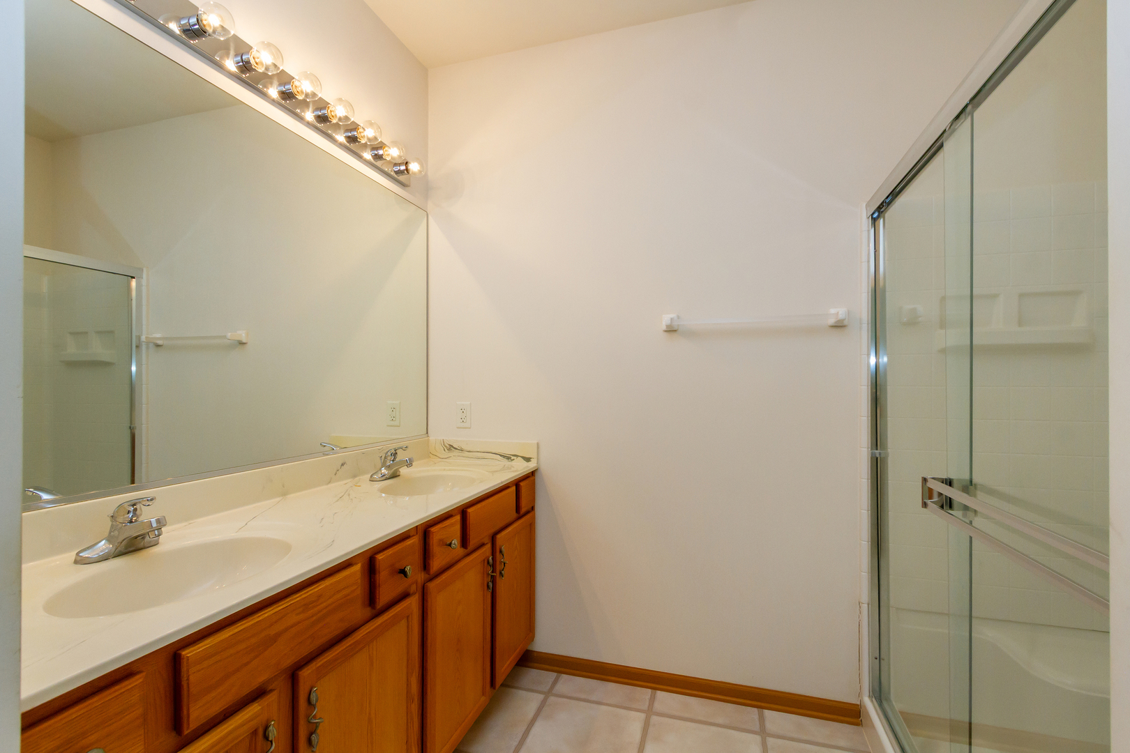 1508 Ludington Circle Romeoville, IL 60446 - Photo 19 of 28 a bathroom with a sink and a mirror