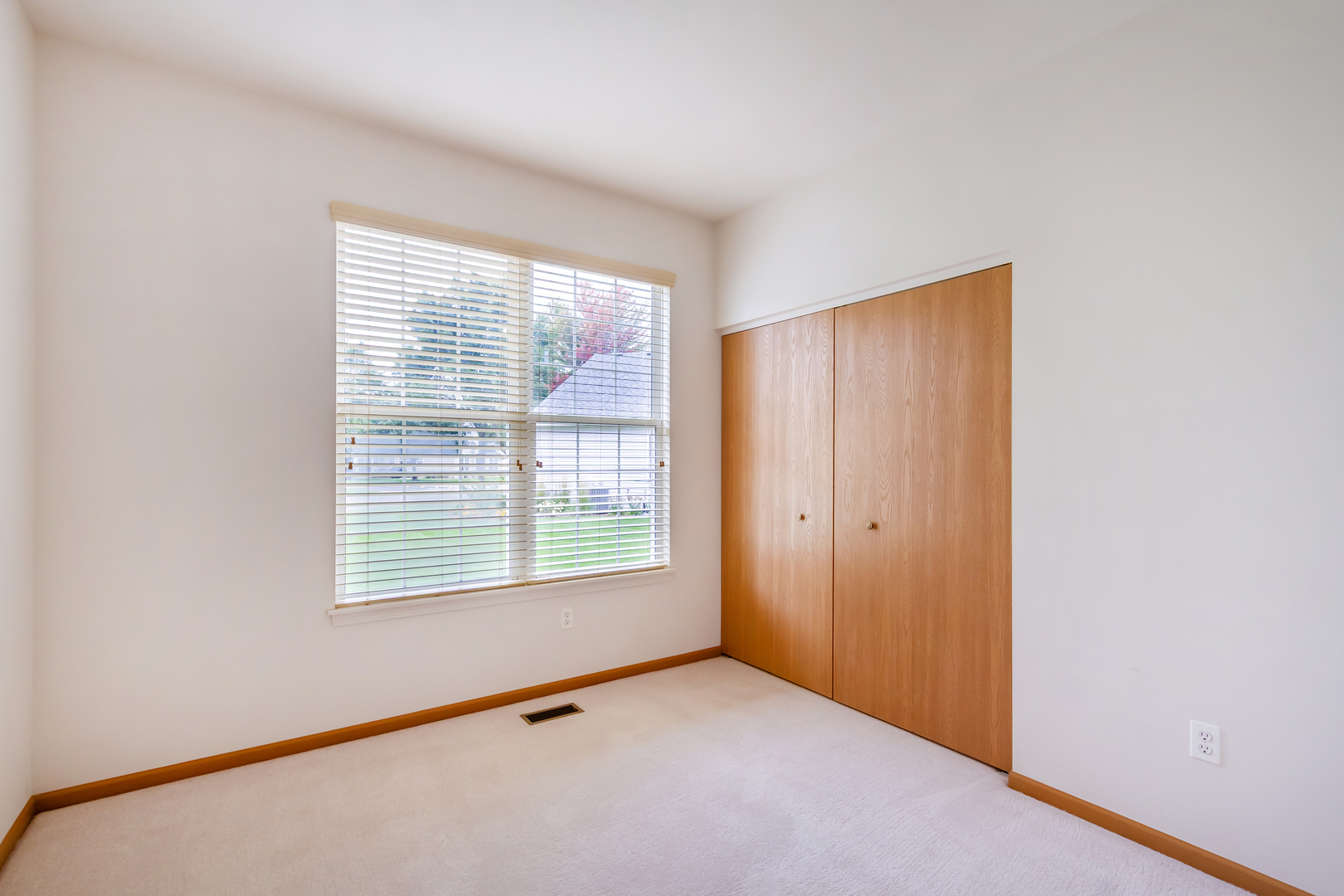 1508 Ludington Circle Romeoville, IL 60446 - Photo 20 of 28 a view of an empty room with a window