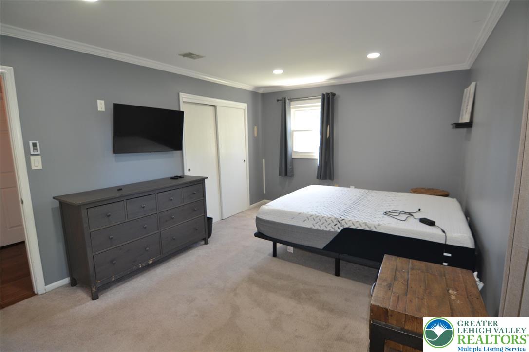 3071 Athena Drive Bethlehem, PA 18017 - Photo 20 of 27 a bedroom with a bed and a flat screen tv