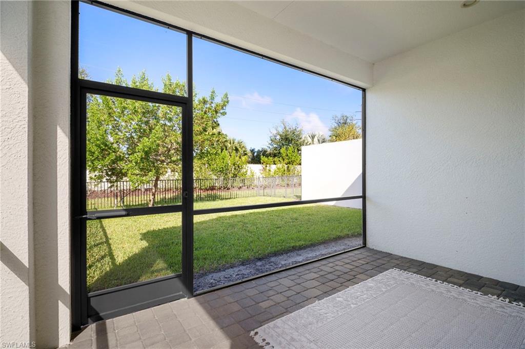 14720 Kingfisher Loop Naples, FL 34120 - Photo 16 of 50 View of unfurnished sunroom