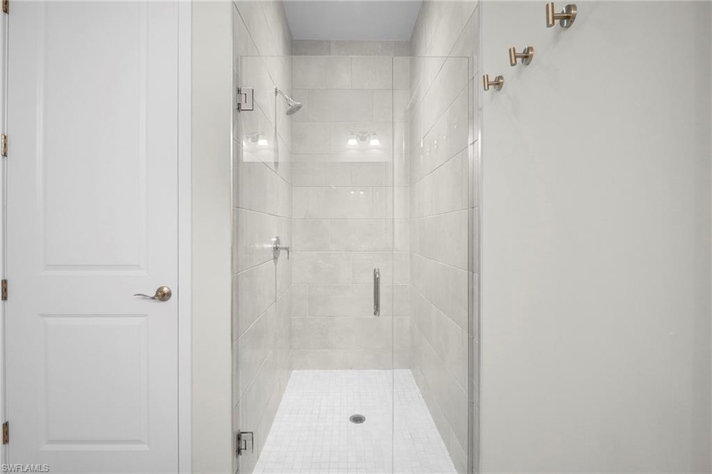14720 Kingfisher Loop Naples, FL 34120 - Photo 32 of 50 Full bathroom with a stall shower