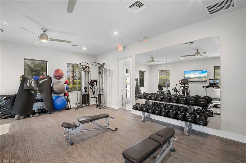 14720 Kingfisher Loop Naples, FL 34120 - Photo 41 of 50 Gym featuring a ceiling fan and recessed lighting