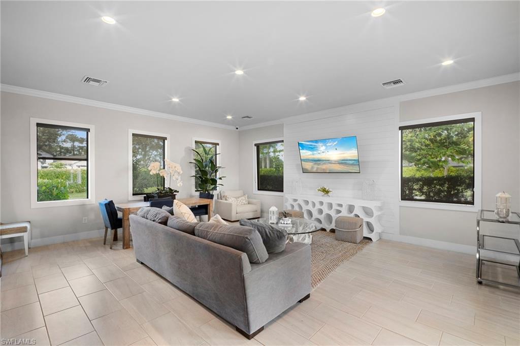 14720 Kingfisher Loop Naples, FL 34120 - Photo 42 of 50 Living area with ornamental molding and recessed lighting