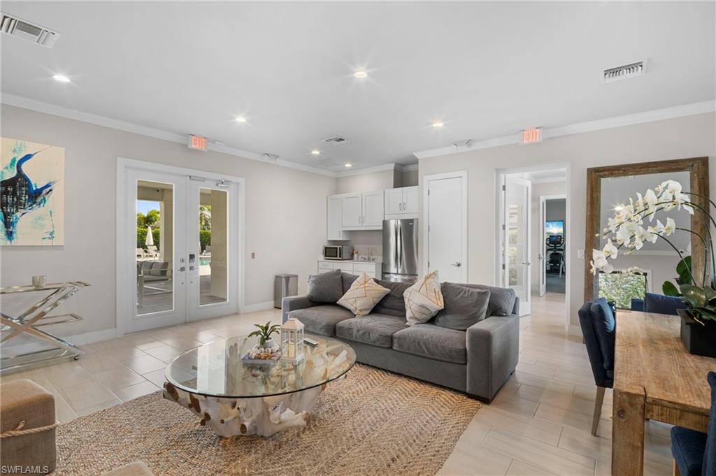 14720 Kingfisher Loop Naples, FL 34120 - Photo 43 of 50 Living room featuring french doors, recessed lighting, and ornamental molding