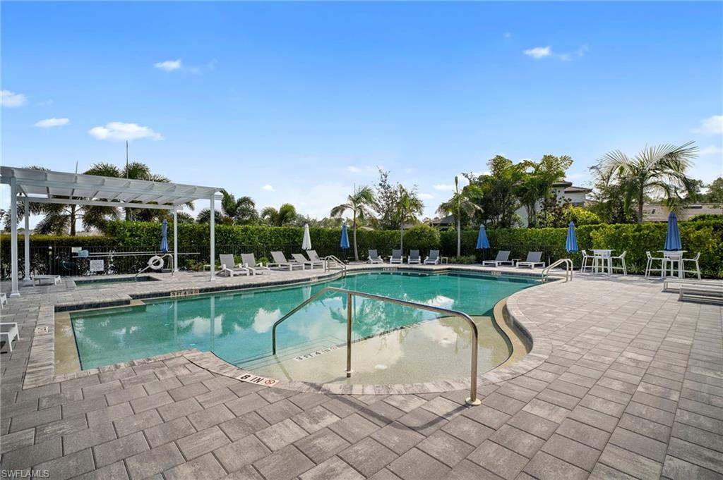 14720 Kingfisher Loop Naples, FL 34120 - Photo 44 of 50 Community pool featuring a patio and a pergola