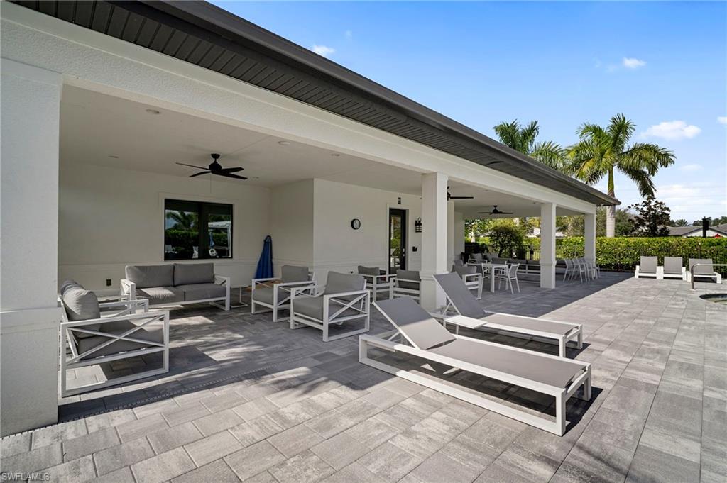 14720 Kingfisher Loop Naples, FL 34120 - Photo 45 of 50 View of patio / terrace with ceiling fan and an outdoor living / dining area