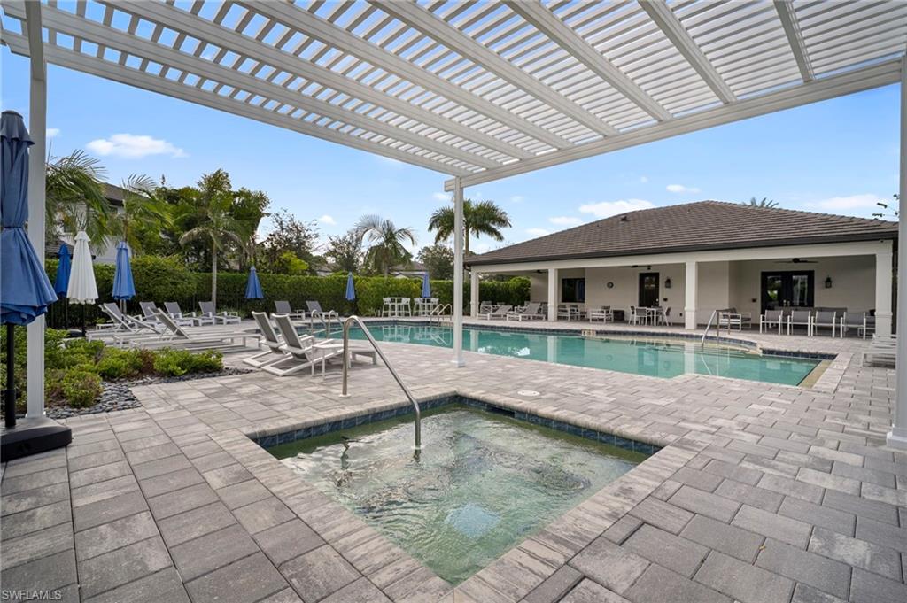 14720 Kingfisher Loop Naples, FL 34120 - Photo 46 of 50 Community pool with a patio area, a community hot tub, and a pergola