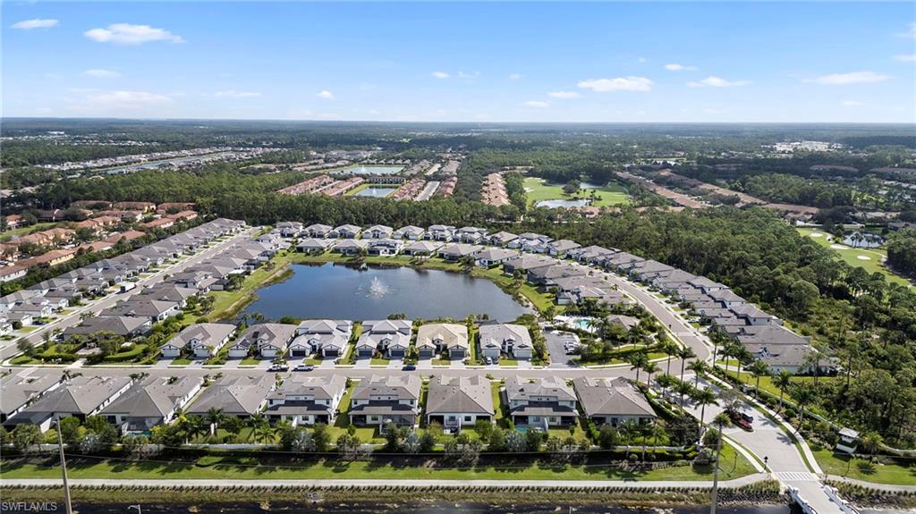 14720 Kingfisher Loop Naples, FL 34120 - Photo 48 of 50 Aerial view of residential area with a nearby body of water