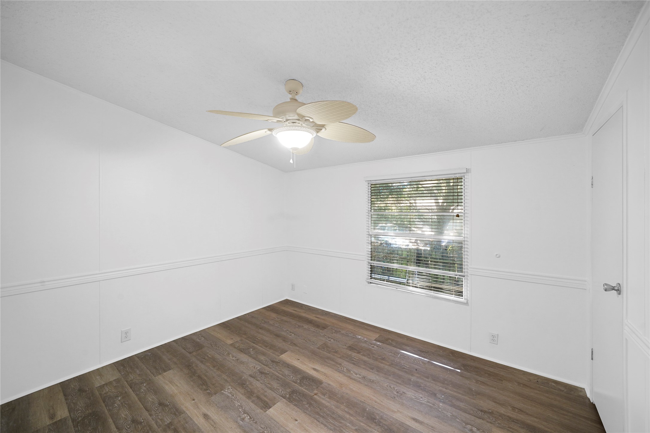 3614 College Street Damon, TX 77430 - Photo 14 of 15 an empty room with wooden floor mirror and window