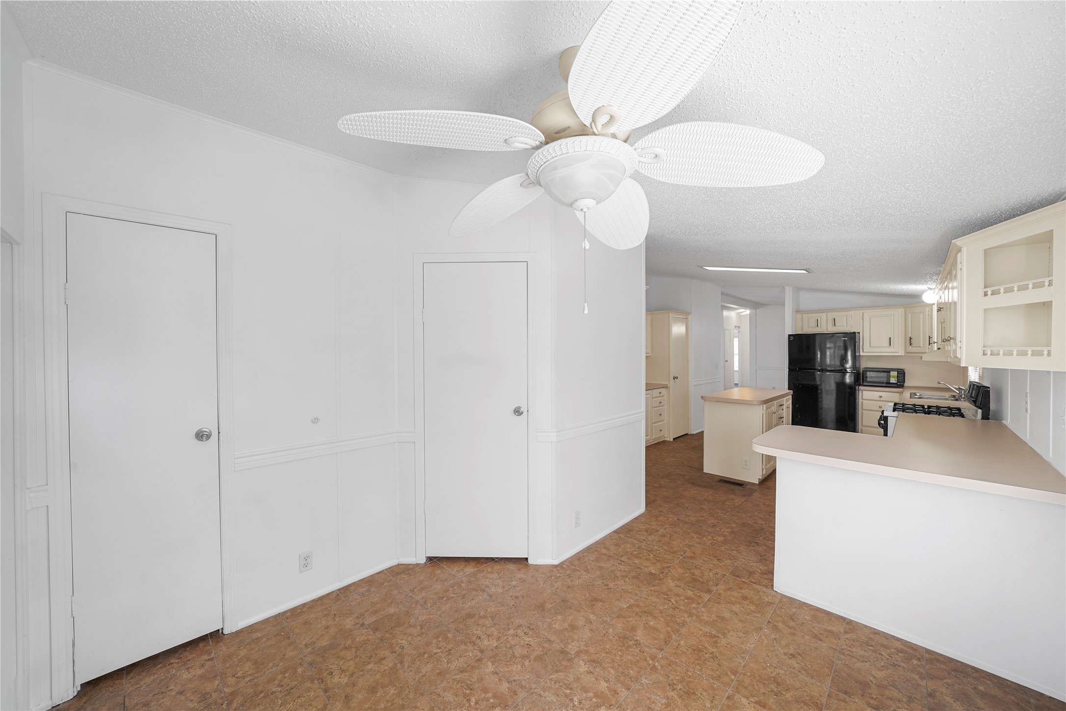 3614 College Street Damon, TX 77430 - Photo 7 of 15 a view of living room with stainless steel appliances cabinets and a chandelier