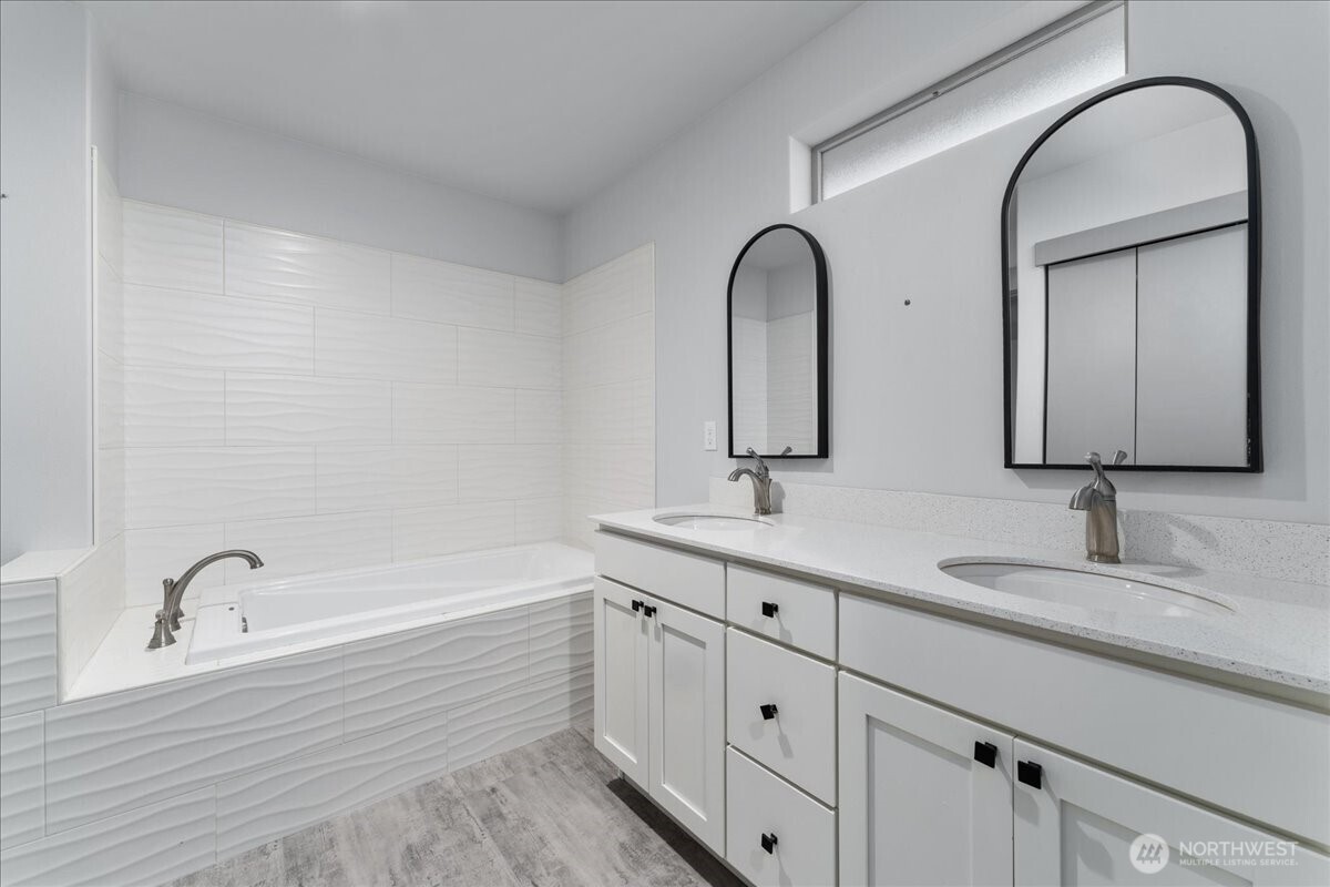 9978 Saska Way Entiat, WA 98822 - Photo 18 of 35 a bathroom with a double vanity sink and mirror