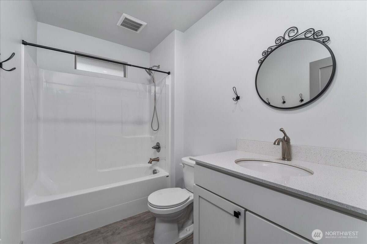 9978 Saska Way Entiat, WA 98822 - Photo 21 of 35 a bathroom with a sink toilet and shower