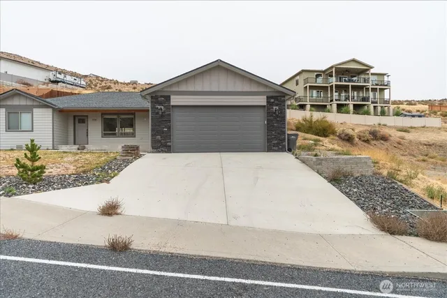 a front view of a house with yard