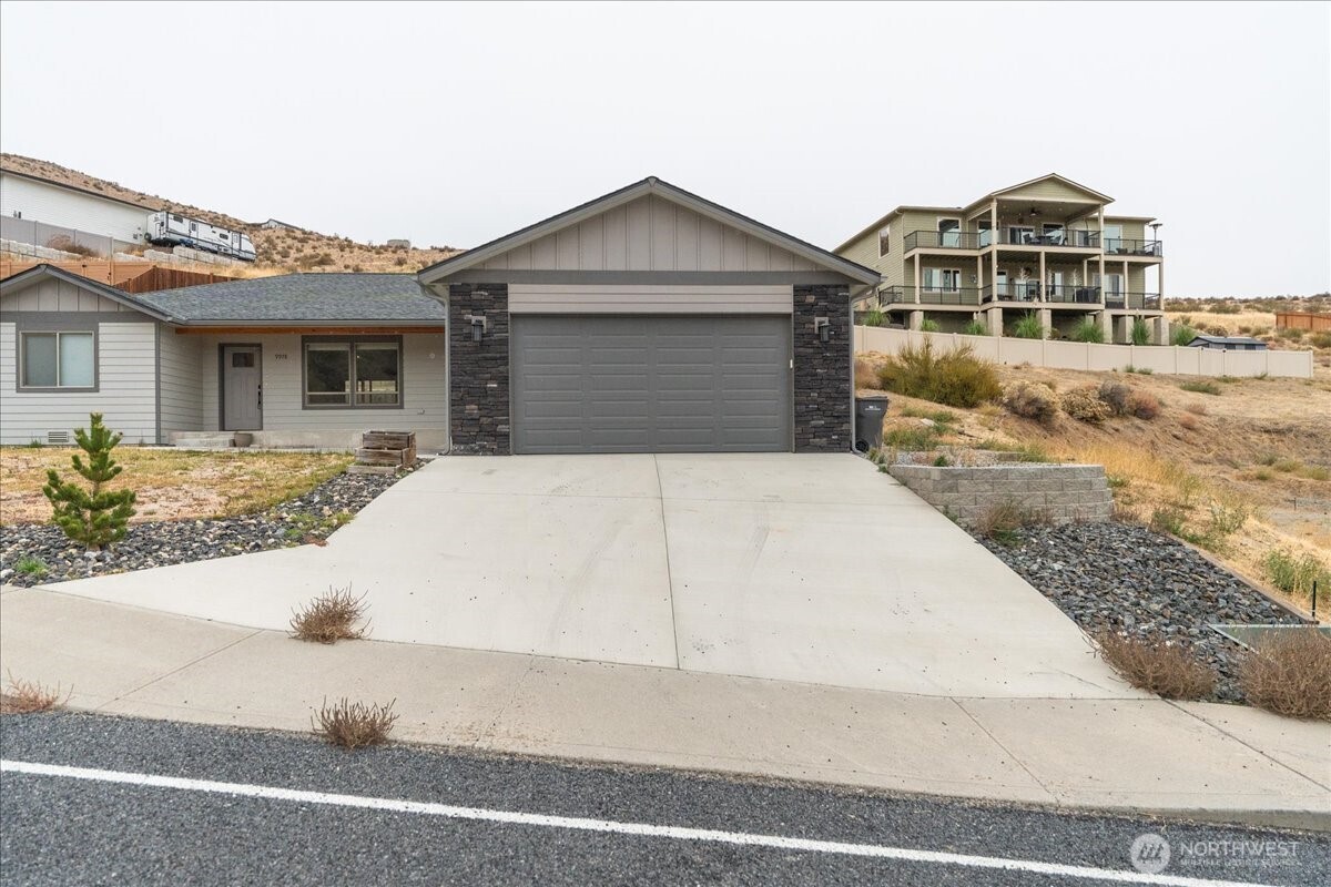9978 Saska Way Entiat, WA 98822 - Photo 25 of 35 a front view of a house with yard