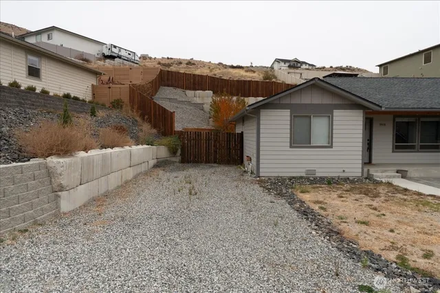 a view of a house with a bed and a couch
