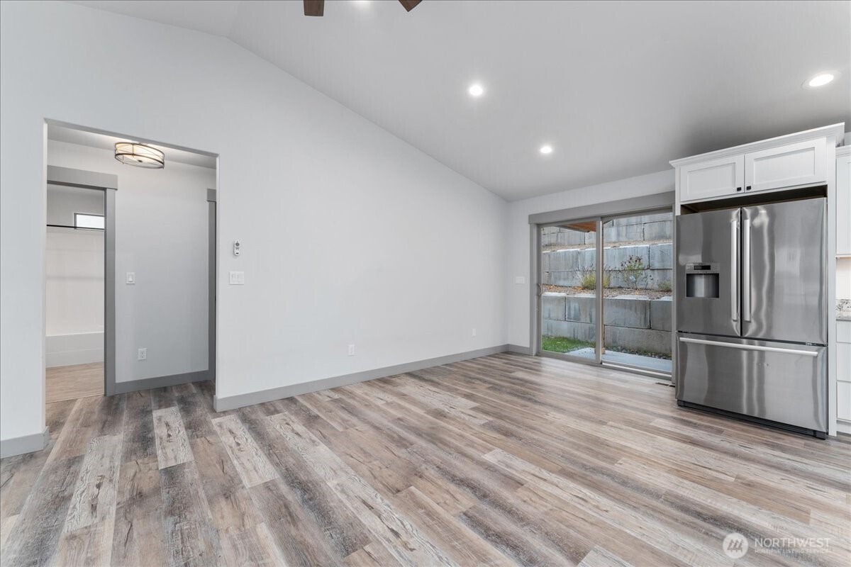 9978 Saska Way Entiat, WA 98822 - Photo 8 of 35 a view of empty room with wooden floor and window
