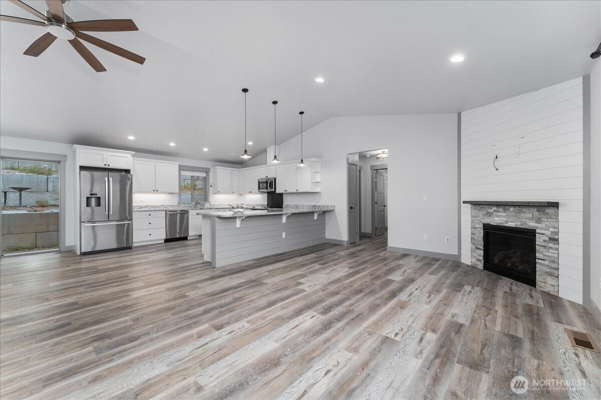 9978 Saska Way Entiat, WA 98822 - Photo 9 of 35 a view of kitchen with wooden floor and a window