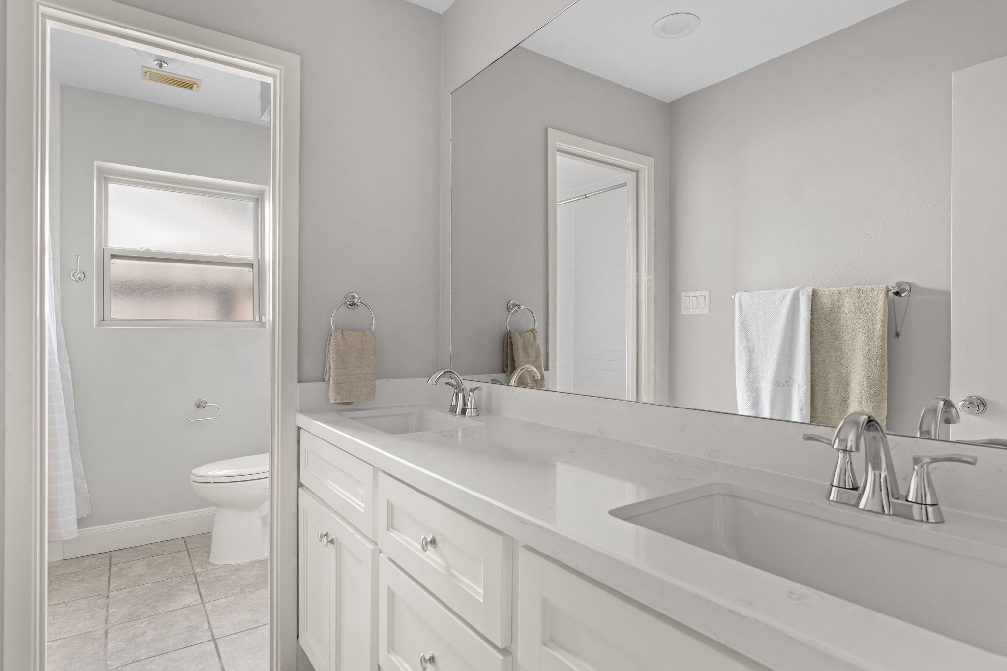 5743 Jason Street Houston, TX 77096 - Photo 21 of 26 a bathroom with a sink a toilet and a large mirror