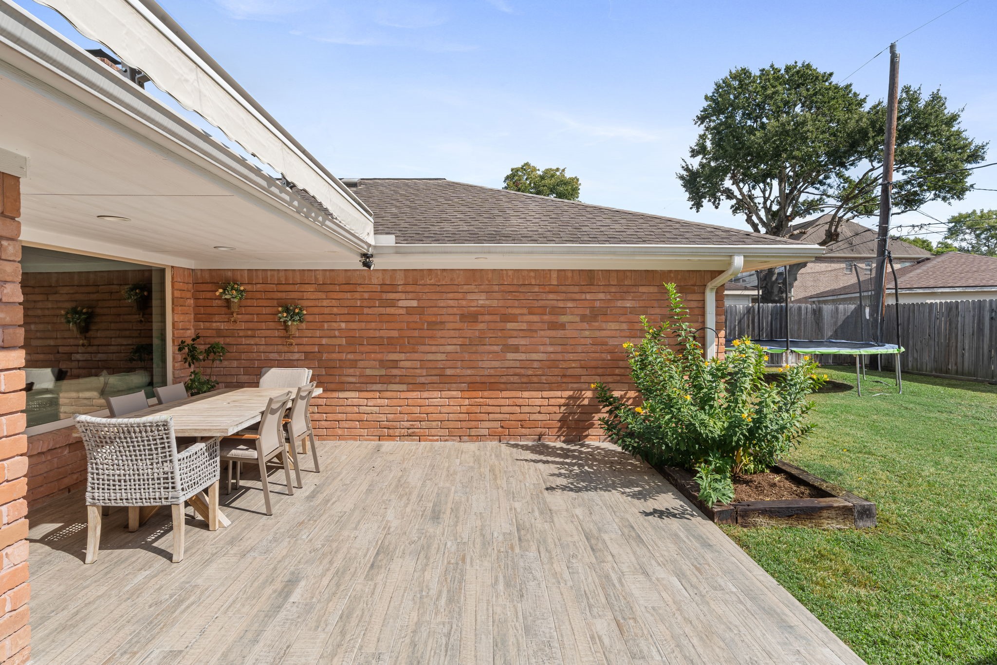 5743 Jason Street Houston, TX 77096 - Photo 23 of 26 a backyard of a house with table and chairs