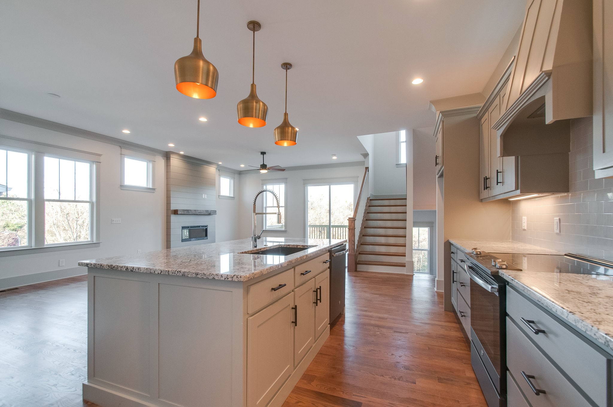 931 Mitchell Road Nashville, TN 37206 - Photo 14 of 39 a kitchen with stainless steel appliances granite countertop a sink a stove and a wooden floors