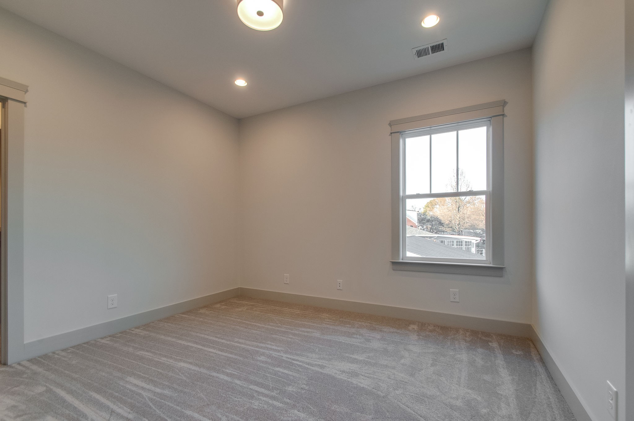 931 Mitchell Road Nashville, TN 37206 - Photo 22 of 39 an empty room with wooden floor and windows