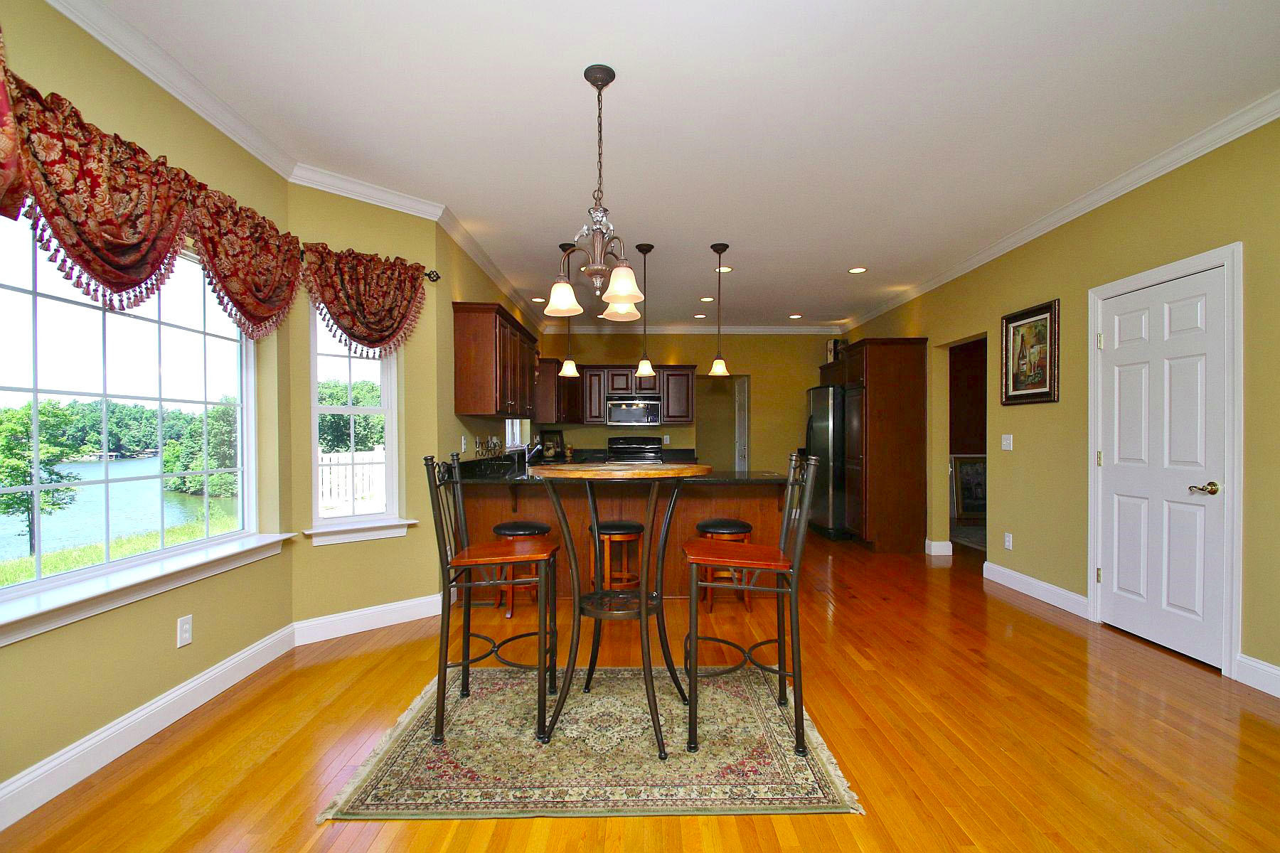 10 Old Point Road Moneta, VA 24121 - Photo 15 of 79 a dining room with furniture and a chandelier