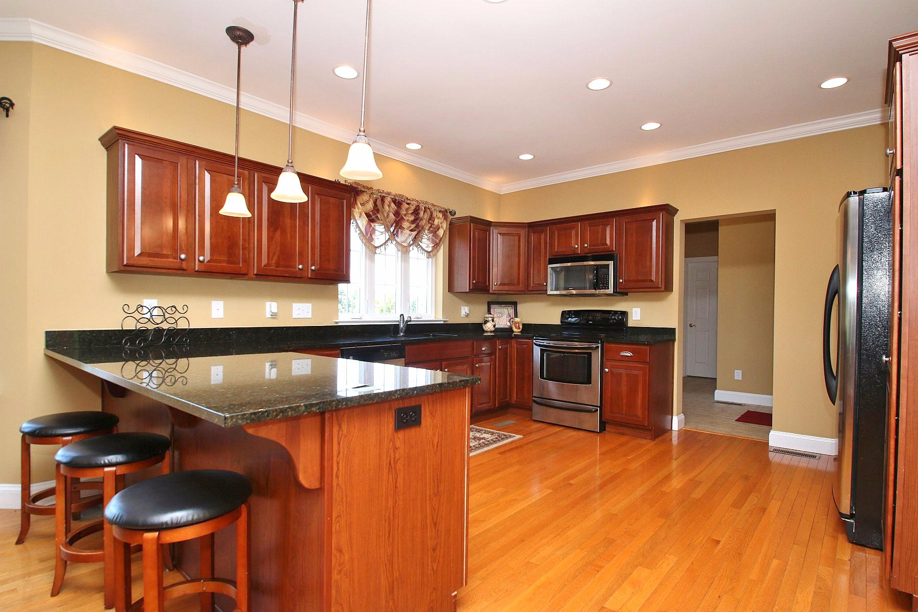 10 Old Point Road Moneta, VA 24121 - Photo 18 of 79 a kitchen with stainless steel appliances granite countertop a sink a stove and a refrigerator