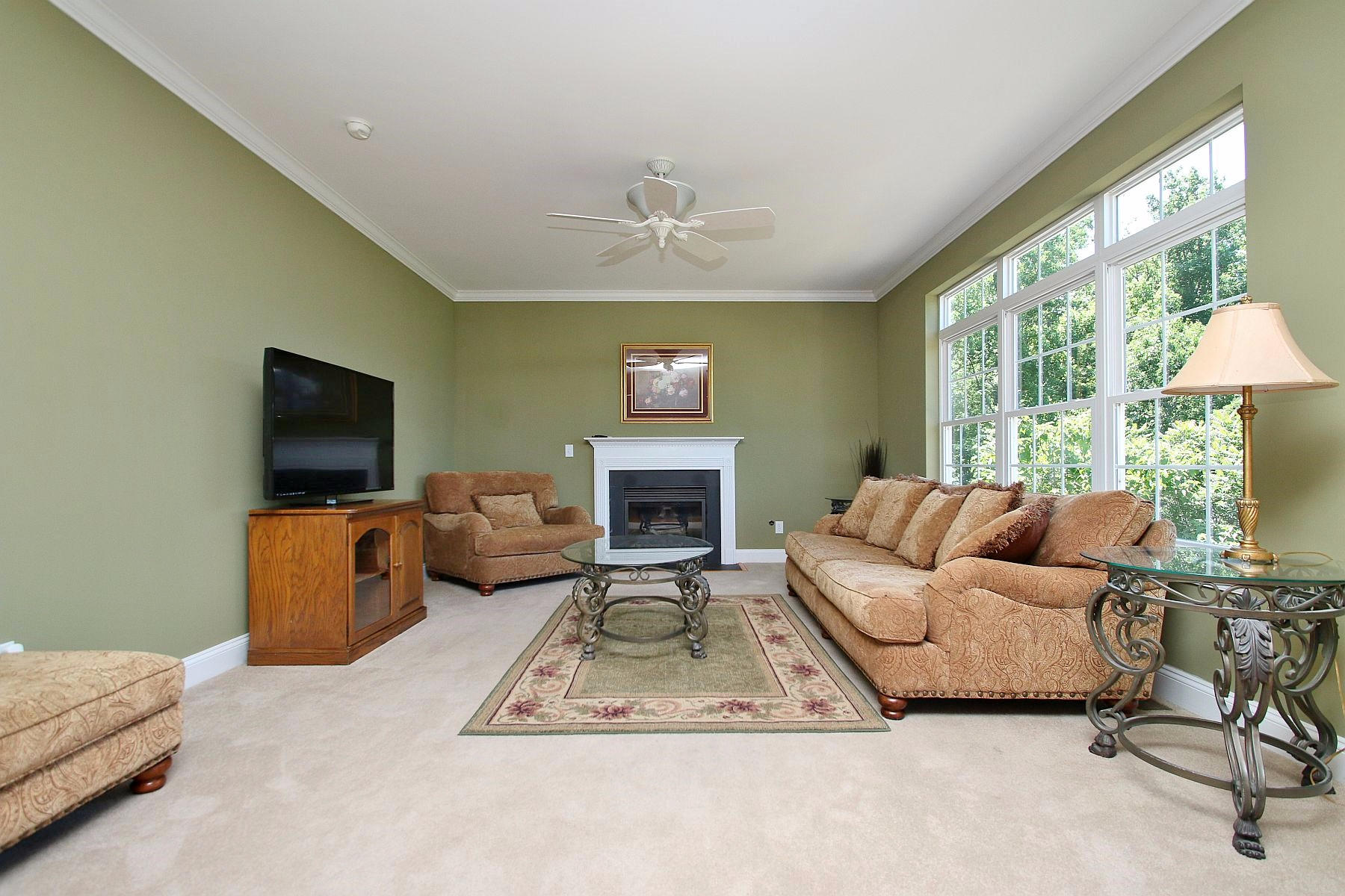 10 Old Point Road Moneta, VA 24121 - Photo 22 of 79 a living room with furniture a flat screen tv and a fireplace