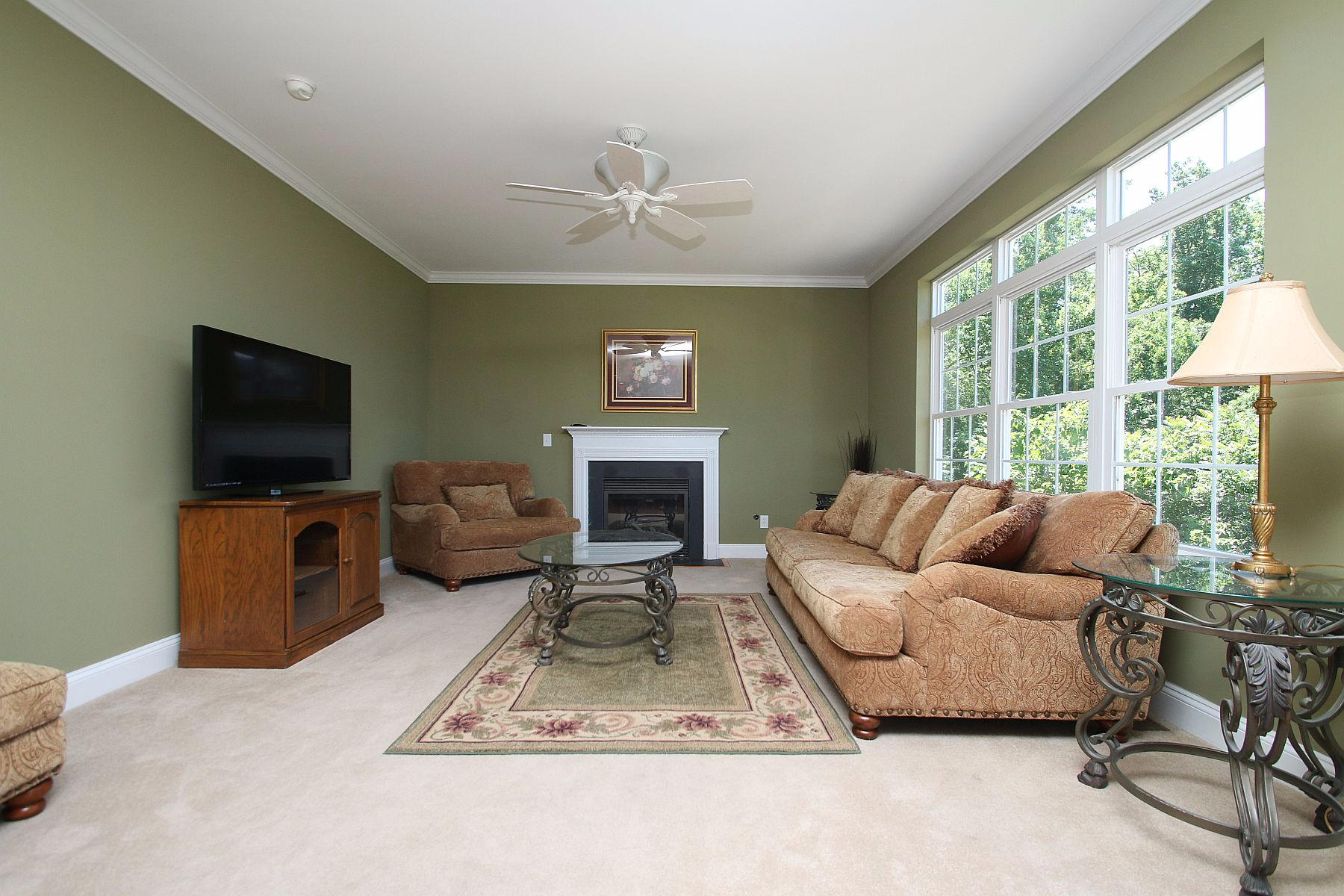 10 Old Point Road Moneta, VA 24121 - Photo 23 of 79 a living room with furniture a flat screen tv and a fireplace